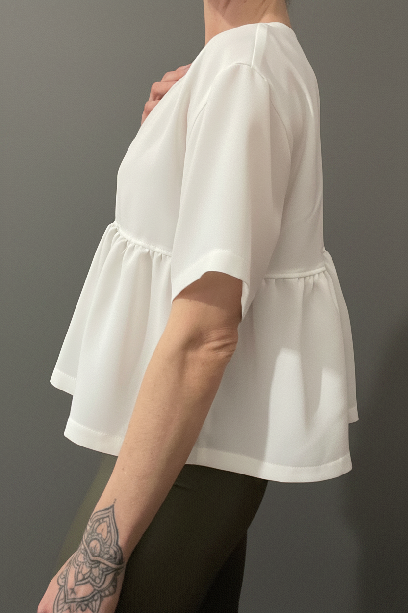 Blusa peplum laterale – tessuto liscio